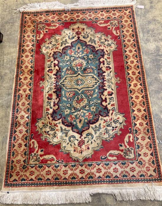 A Caucasian blue ground rug, 128 x 89cm, a Persian style red ground mat and a gold ground rug